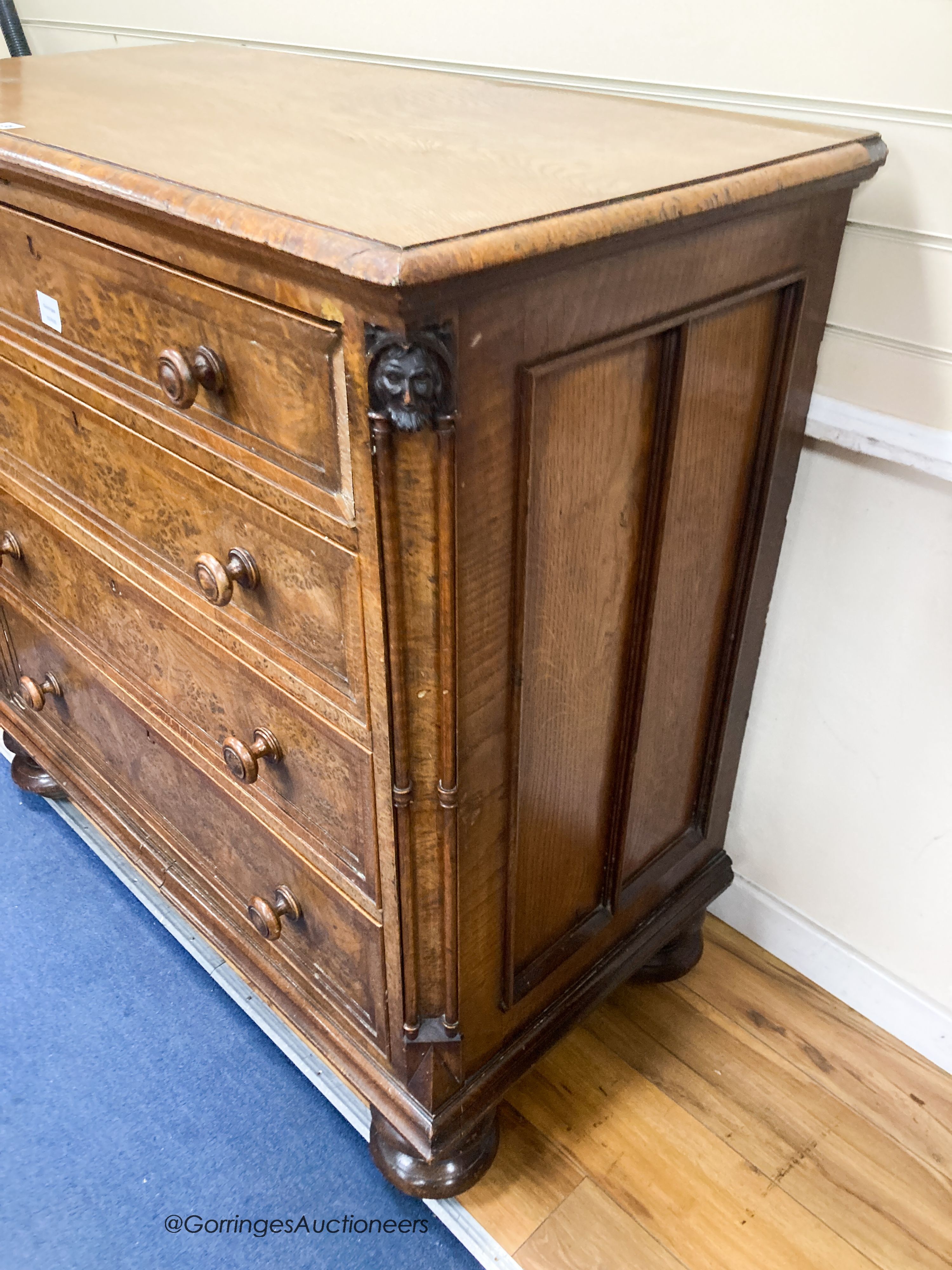 A mid 19th century oak and pollard oak chest fitted four long graduated drawers, width 114cm, depth 59cm, height 113cm